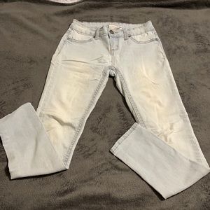 Red Camel light colored stretchy skinny jeans.